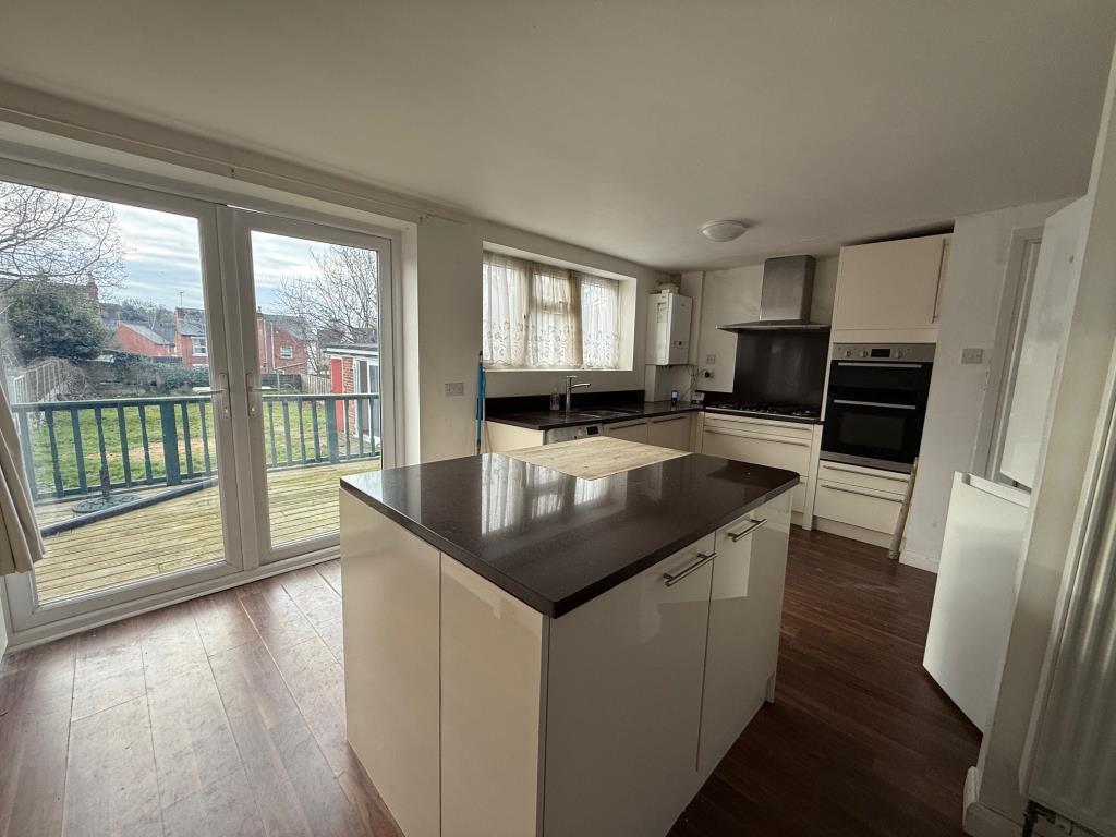Lot: 40 - DETACHED HOUSE FOR IMPROVEMENT AND REPAIR - Alternative view of the kitchen and french door to garden